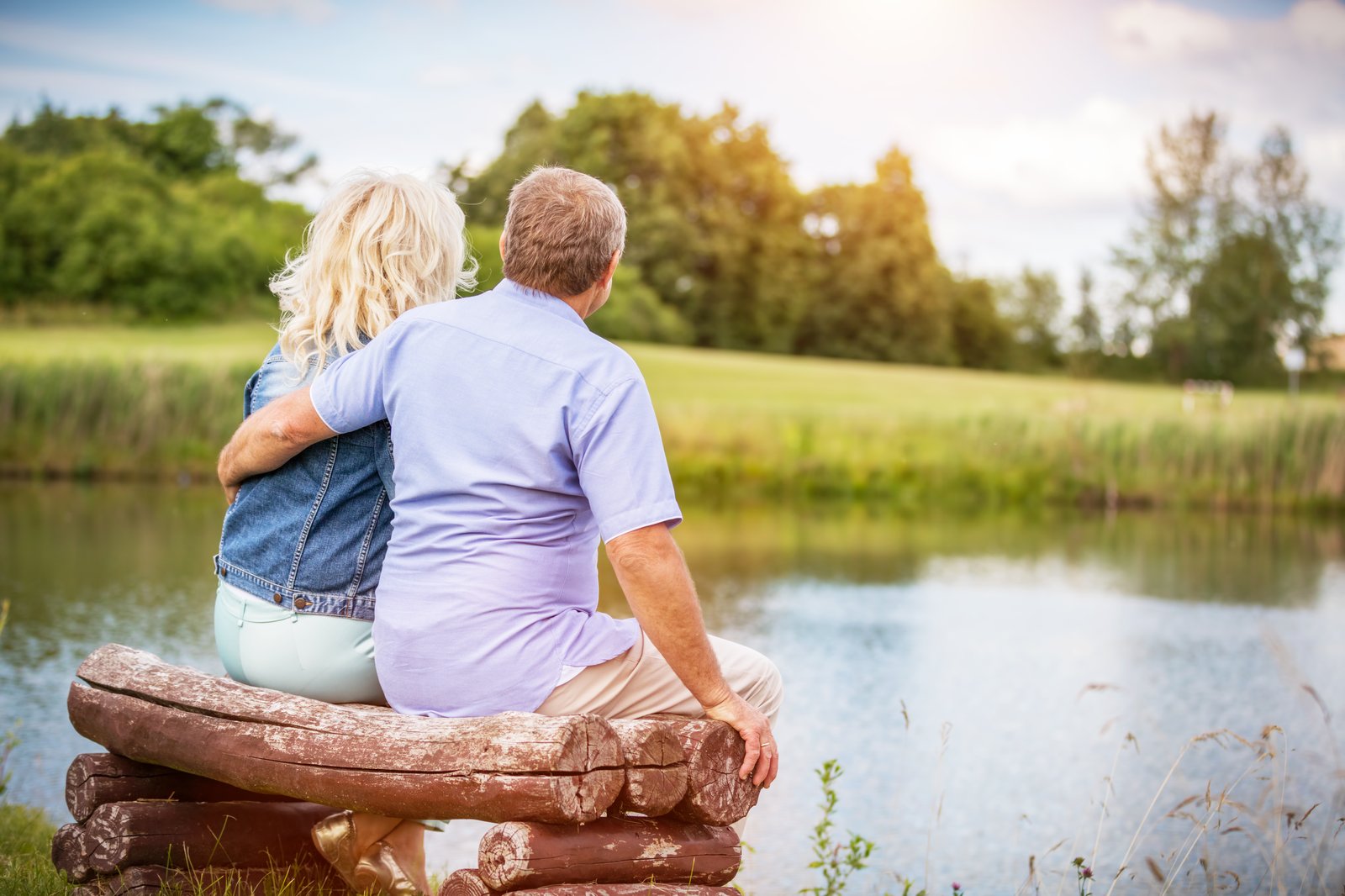 An older couple enjoying a conversation together outdoors